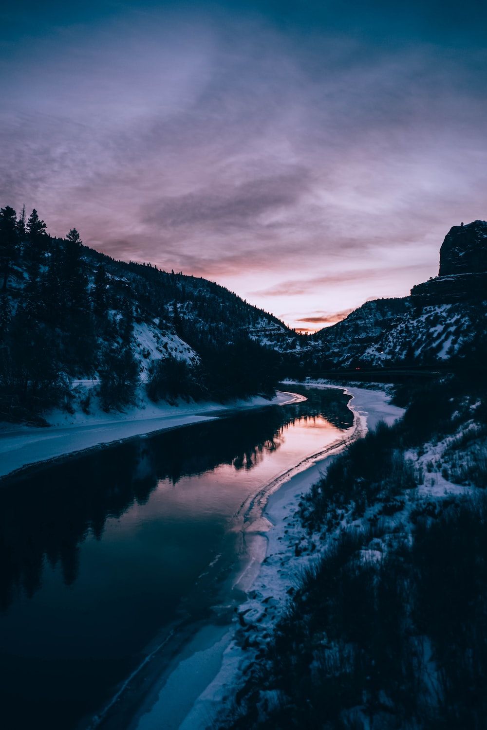 A river in a mountain valley at sunset. - River