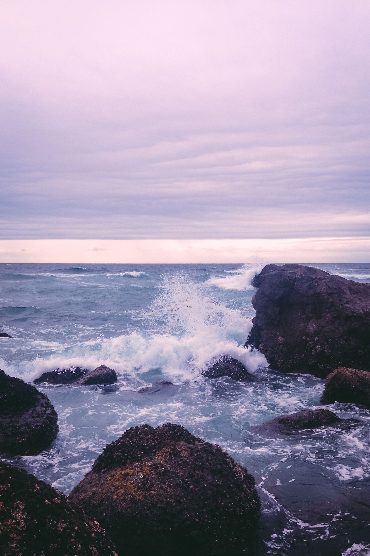 Waves crashing against the rocks at the beach - River