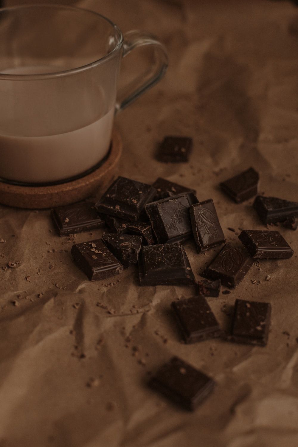 A cup of coffee and some chocolate on the table - Chocolate