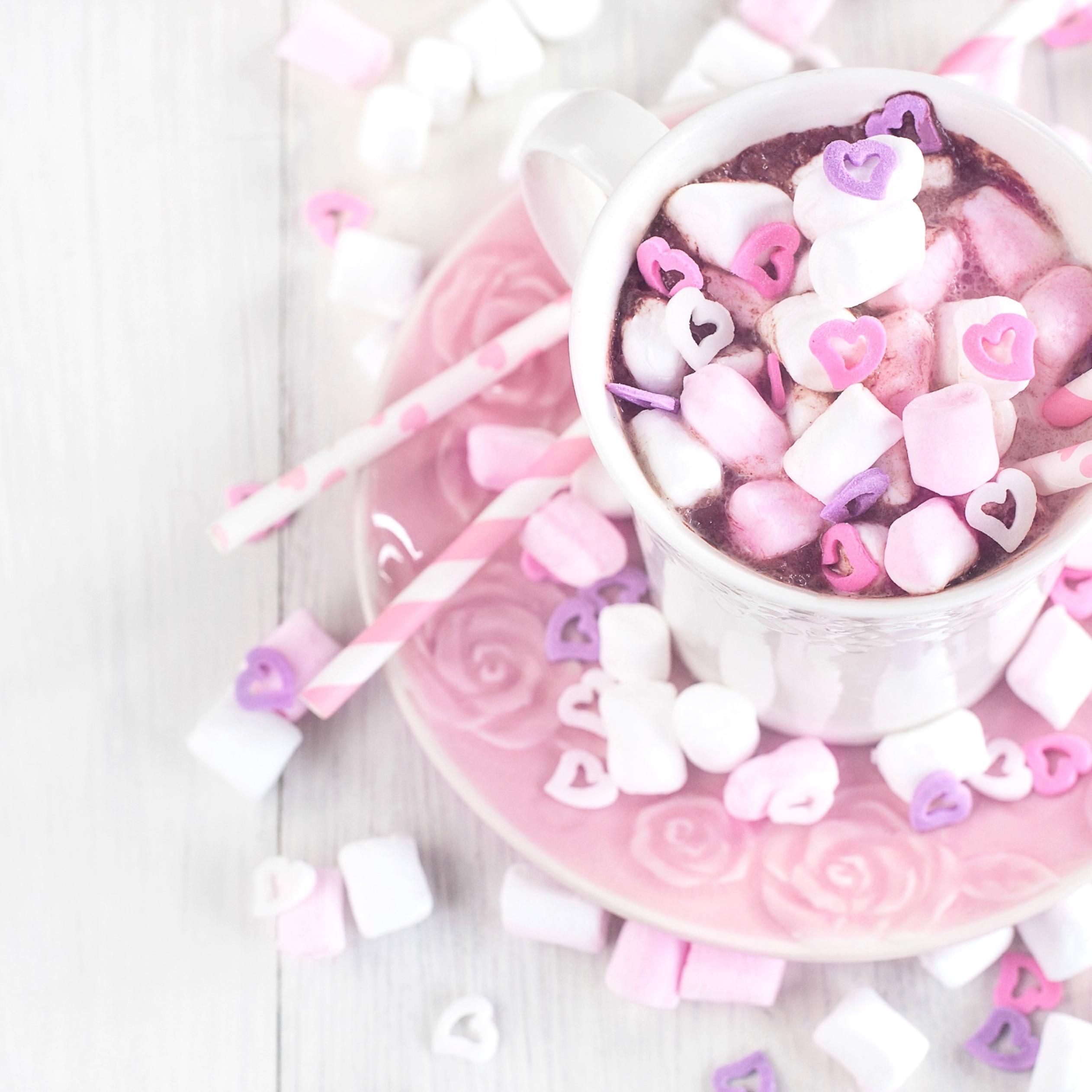 Sweet pink candies in a hot chocolate cup