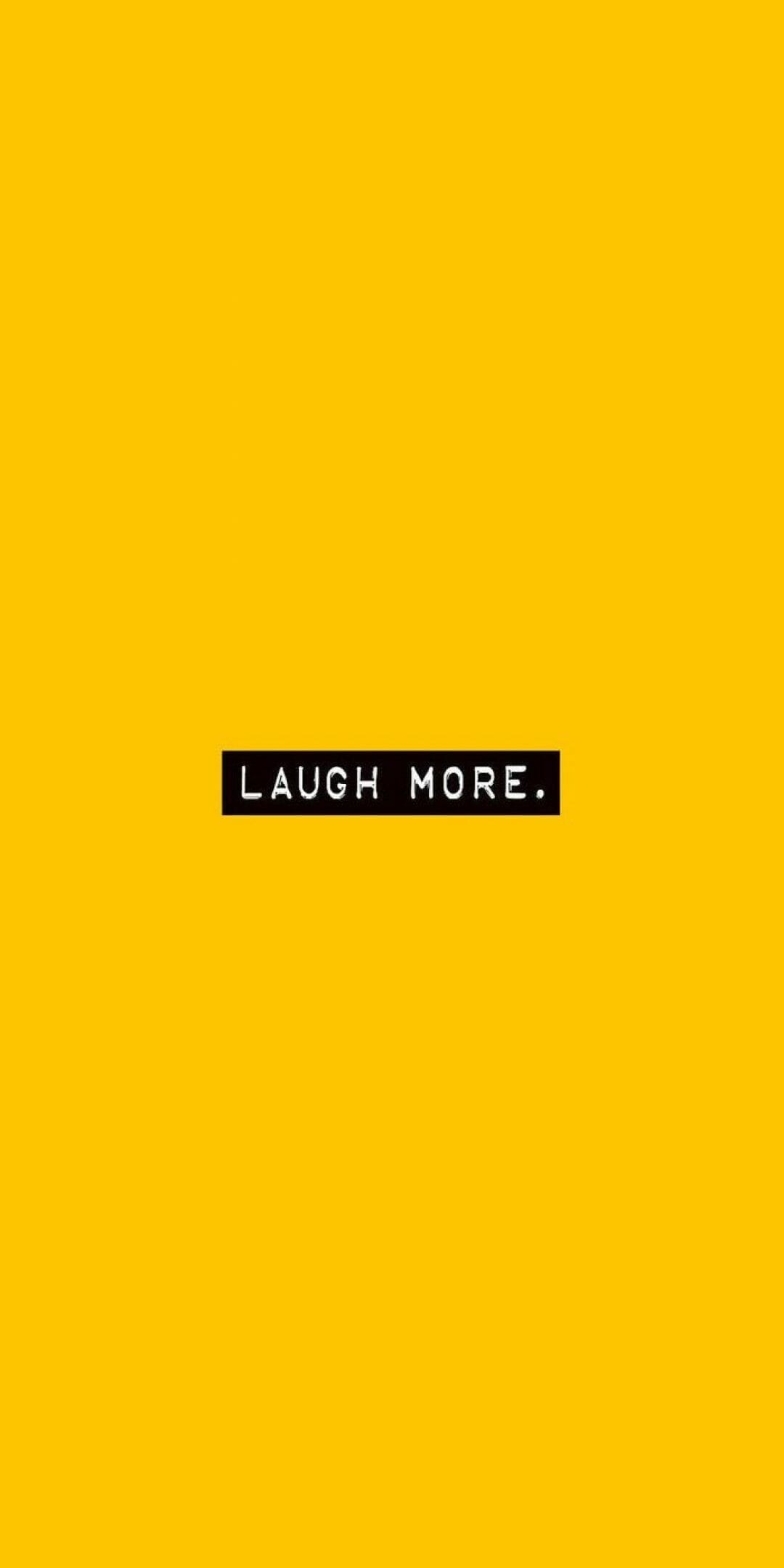 A yellow background with the words laugh more - Yellow