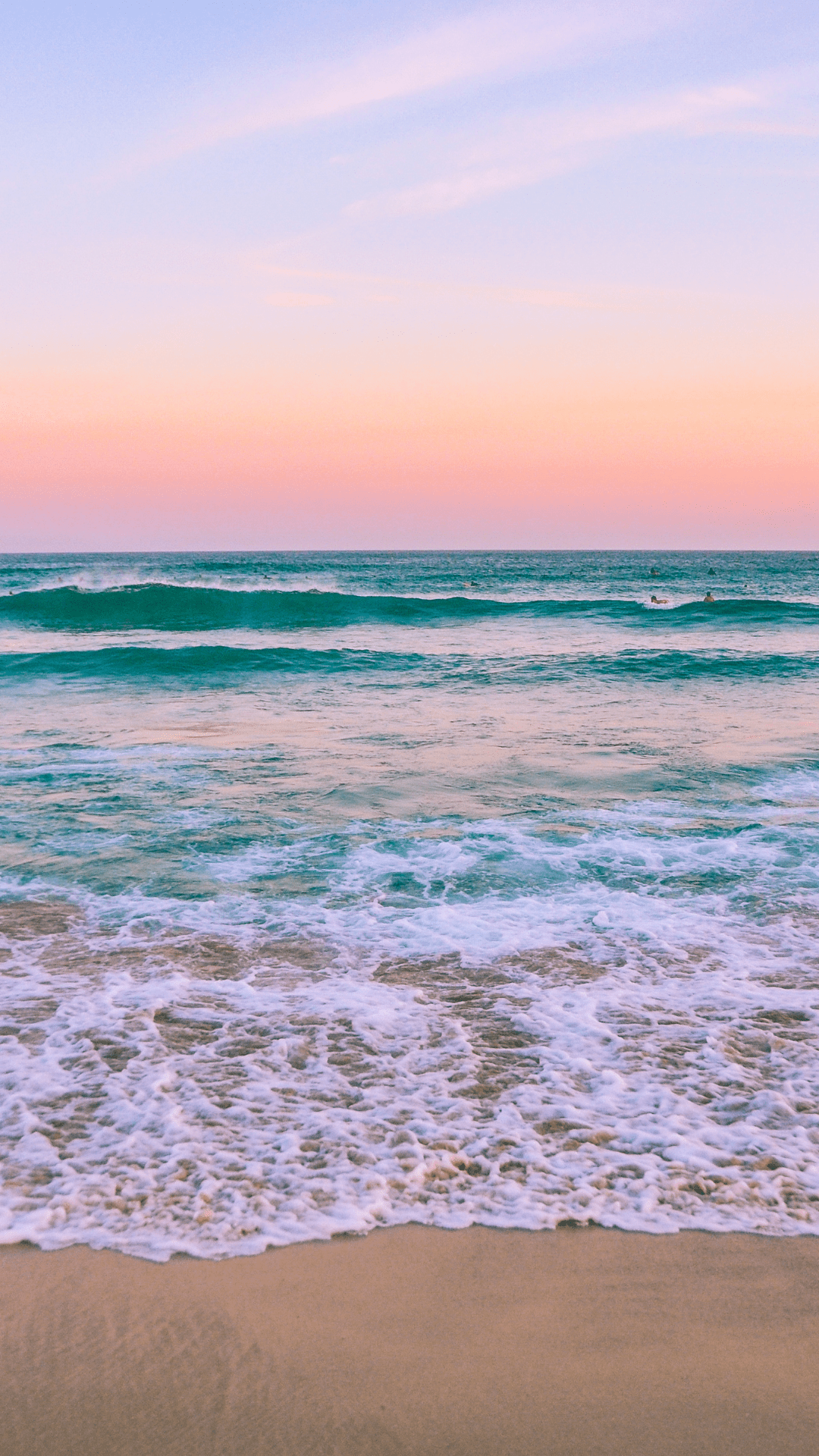 A picture of the ocean with a pink and blue sunset. - Summer, beach