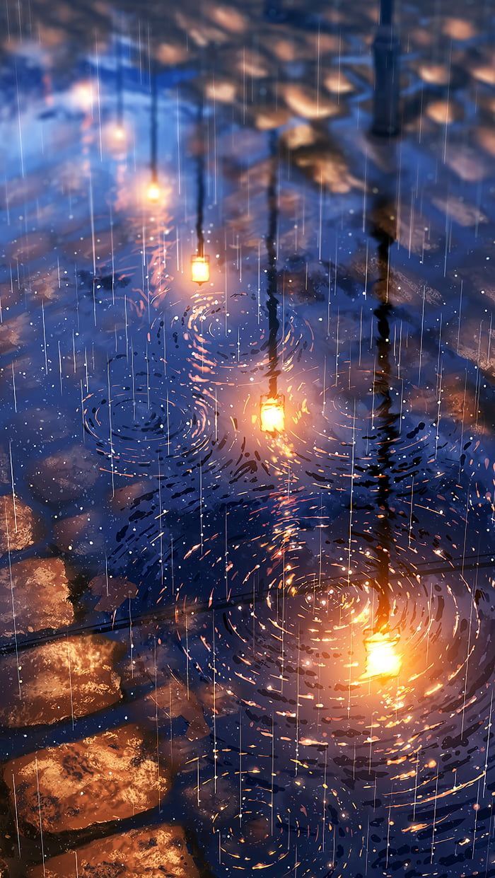 A puddle of water with lights reflecting in it - Rain