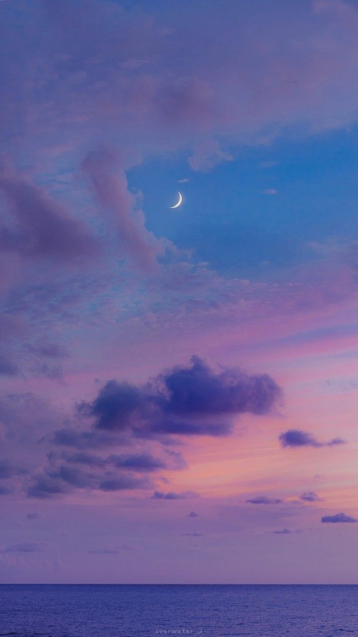 Moon in the sky, pink and blue clouds, and the sea - Scenery