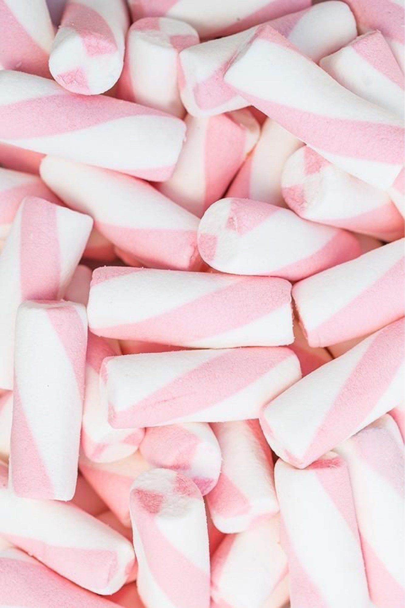 A close up of pink and white marshmallows - Marshmallows