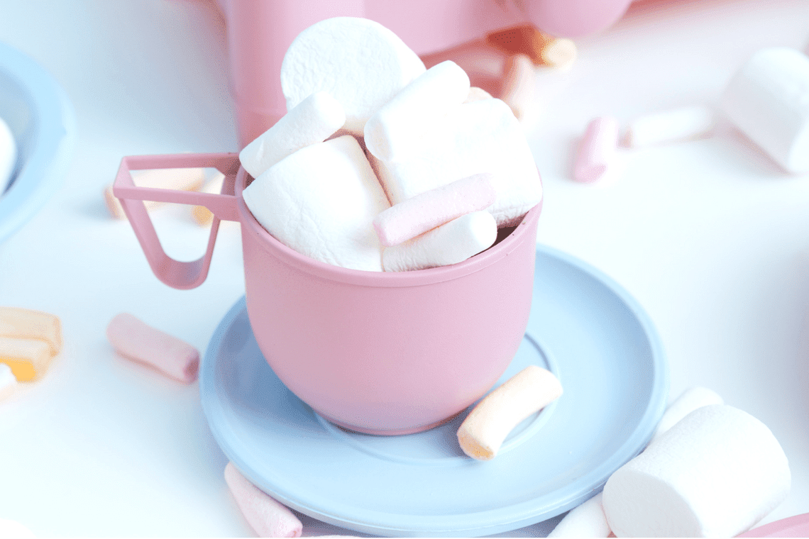 A pink cup filled with marshmallows - Marshmallows