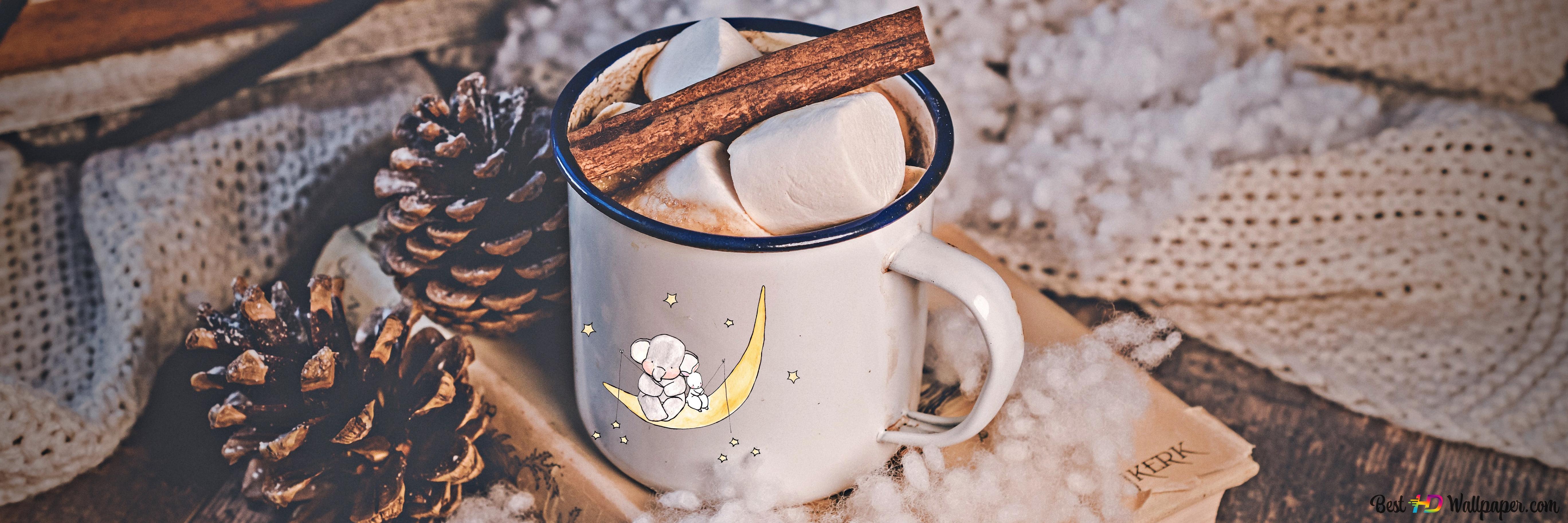 A cup of hot chocolate with marshmallows and cinnamon sticks. - Marshmallows