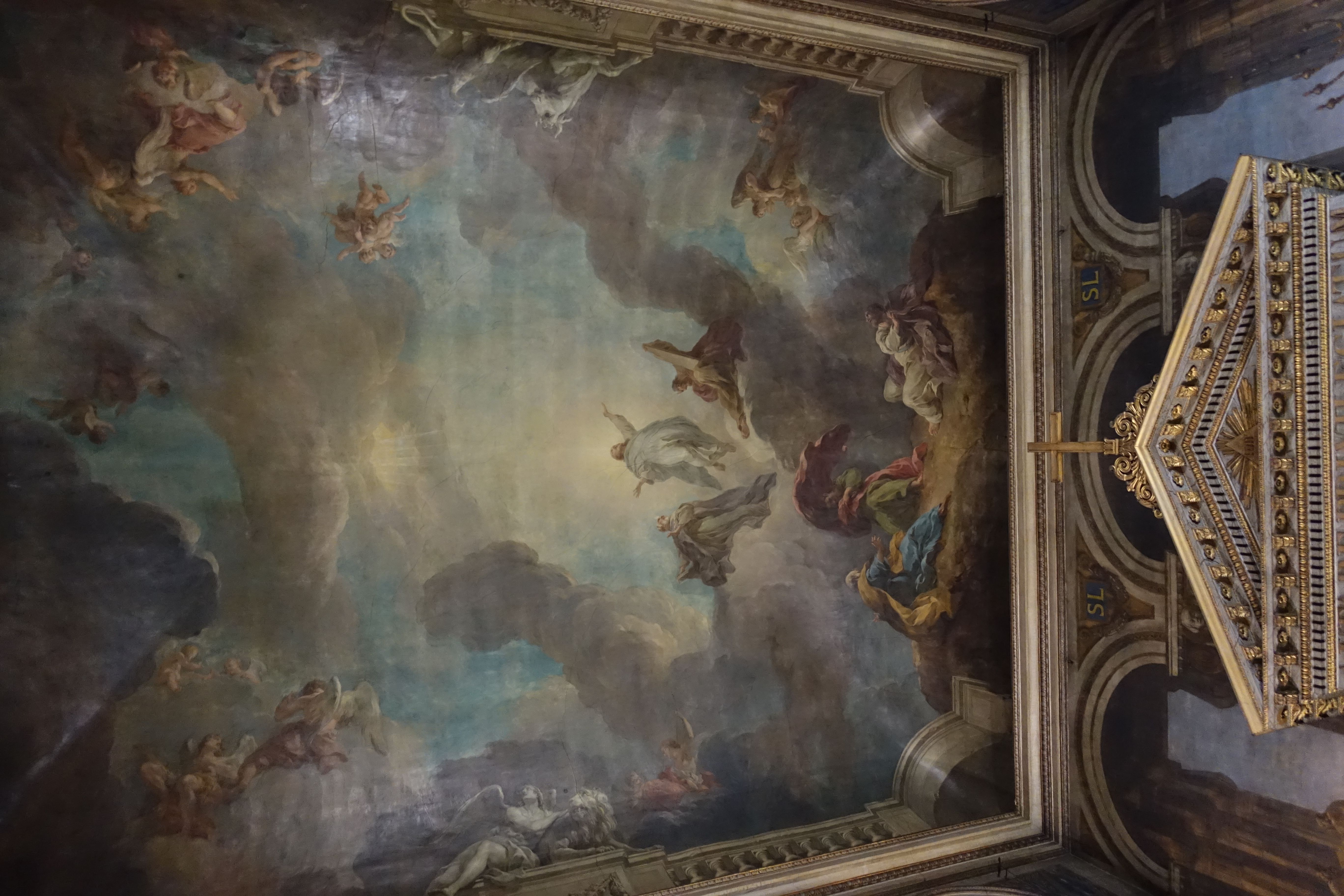 The ceiling of the cathedral is painted with religious figures. - Angelcore