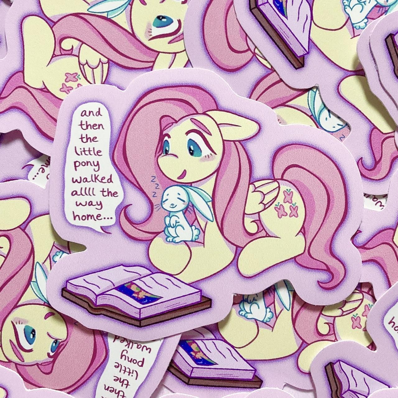 A sticker of Fluttershy reading a book - Internetcore