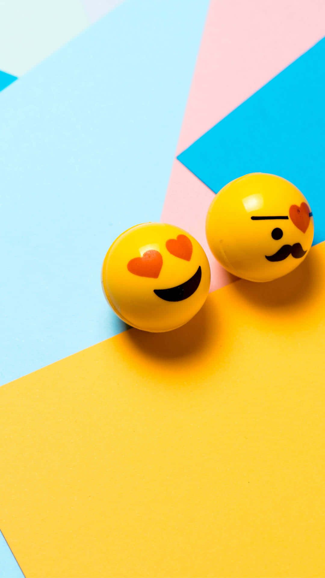 Two smileys on a colorful background - Emoji