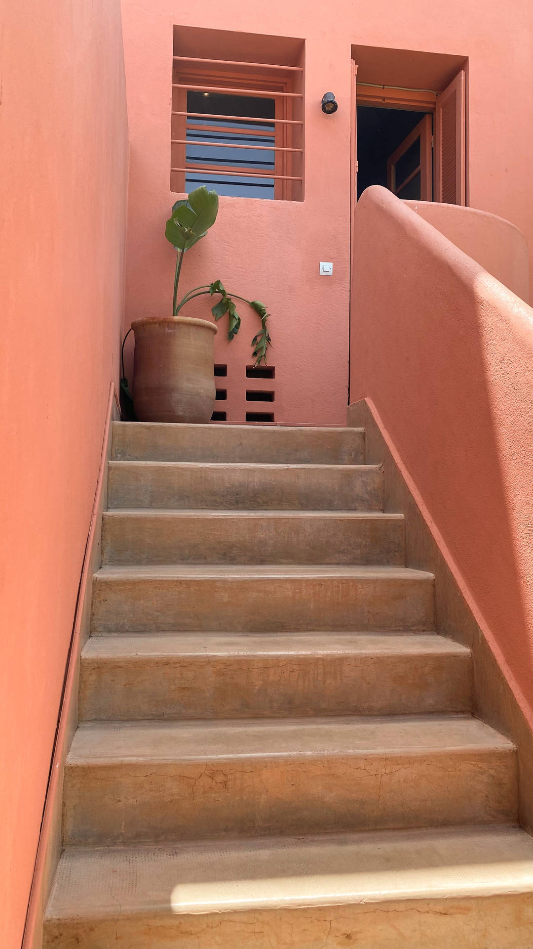 A stairway leading up to the second floor - Terracotta