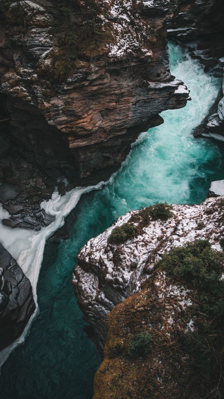 A river flows through a rocky canyon in this stunning photo. - River