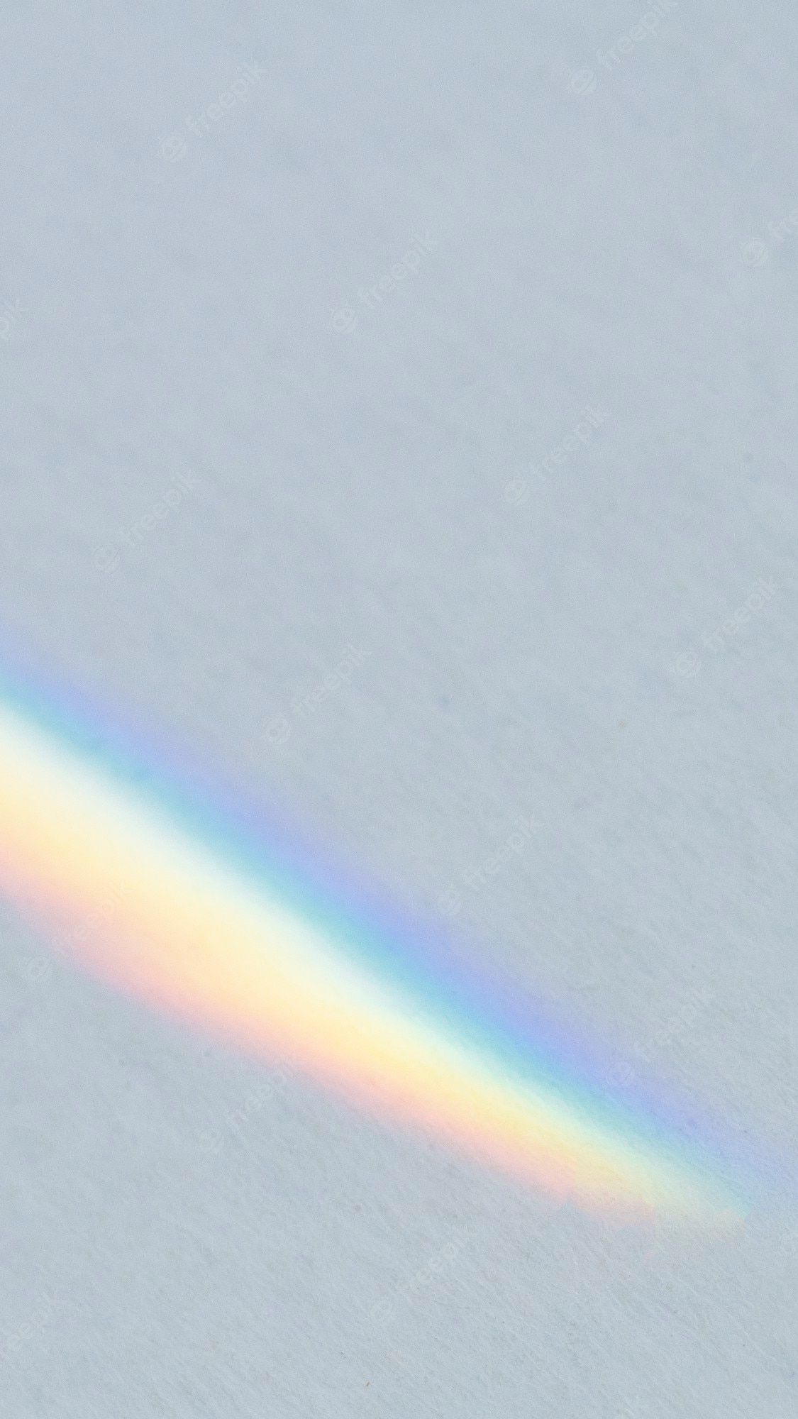 A rainbow, or a rainbow-like arc, appears on the snow. - Rainbows