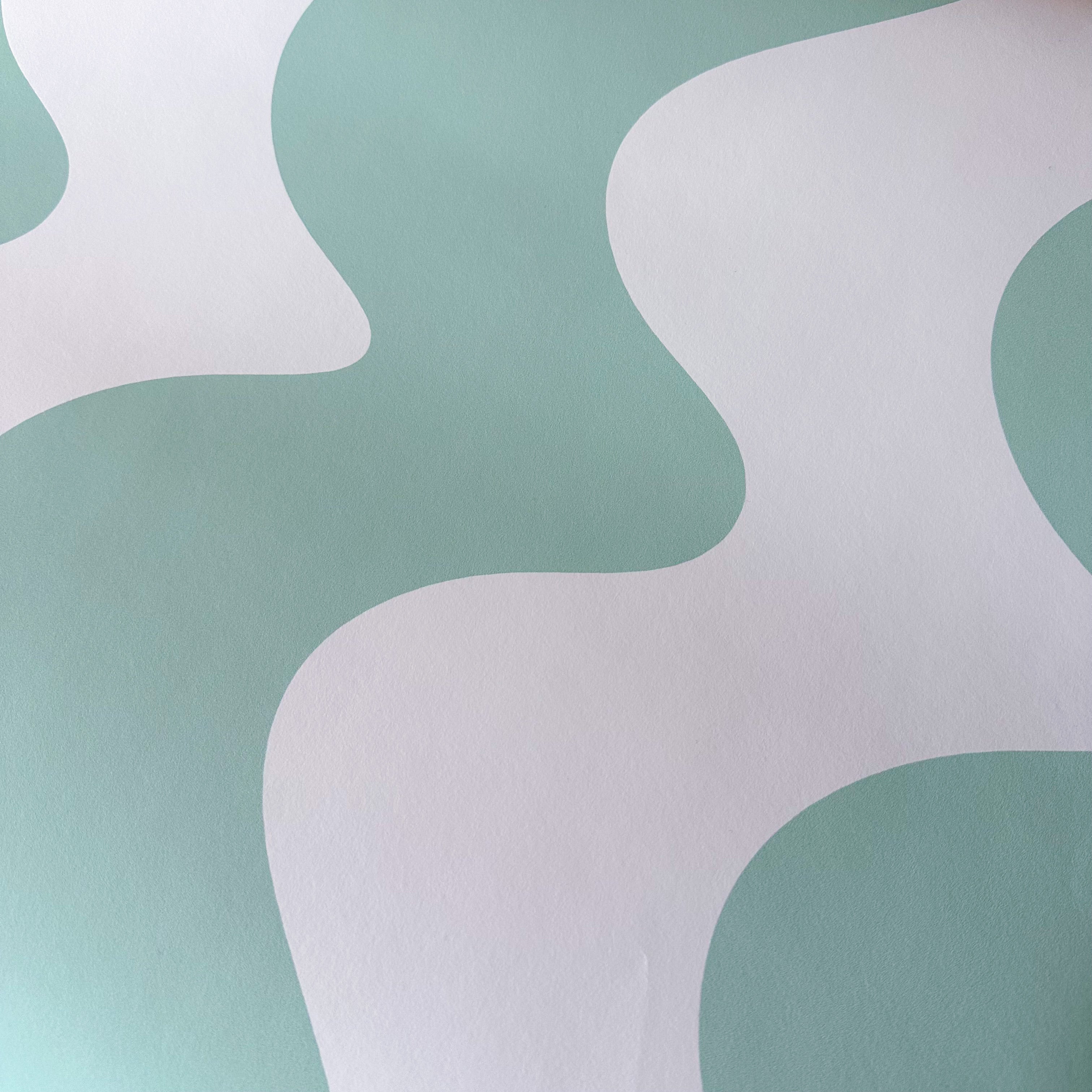 A close up of a wall with a pattern of abstract shapes in white and mint green. - Mint green, pastel green