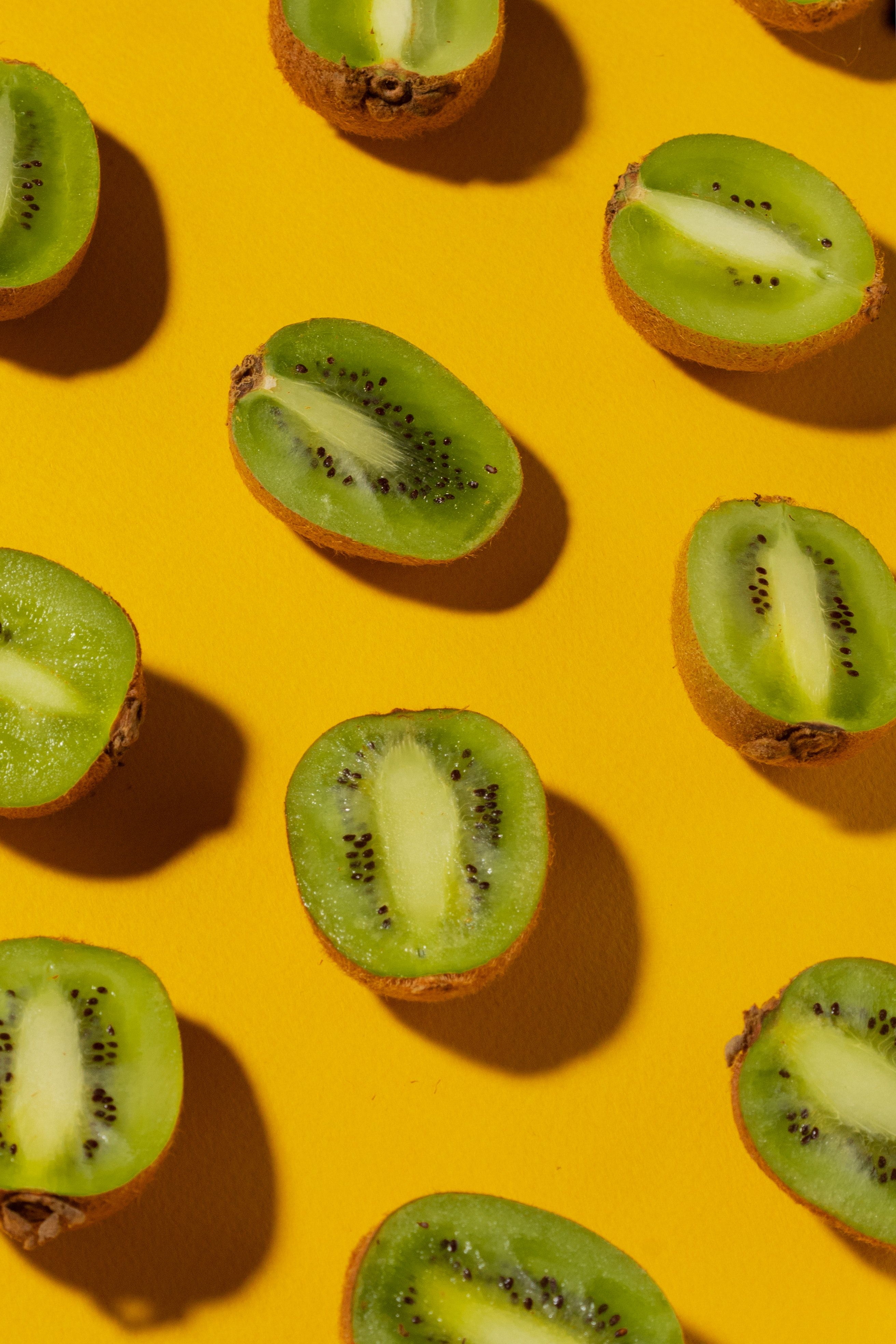 A bunch of kiwi fruit on yellow - Kiwi