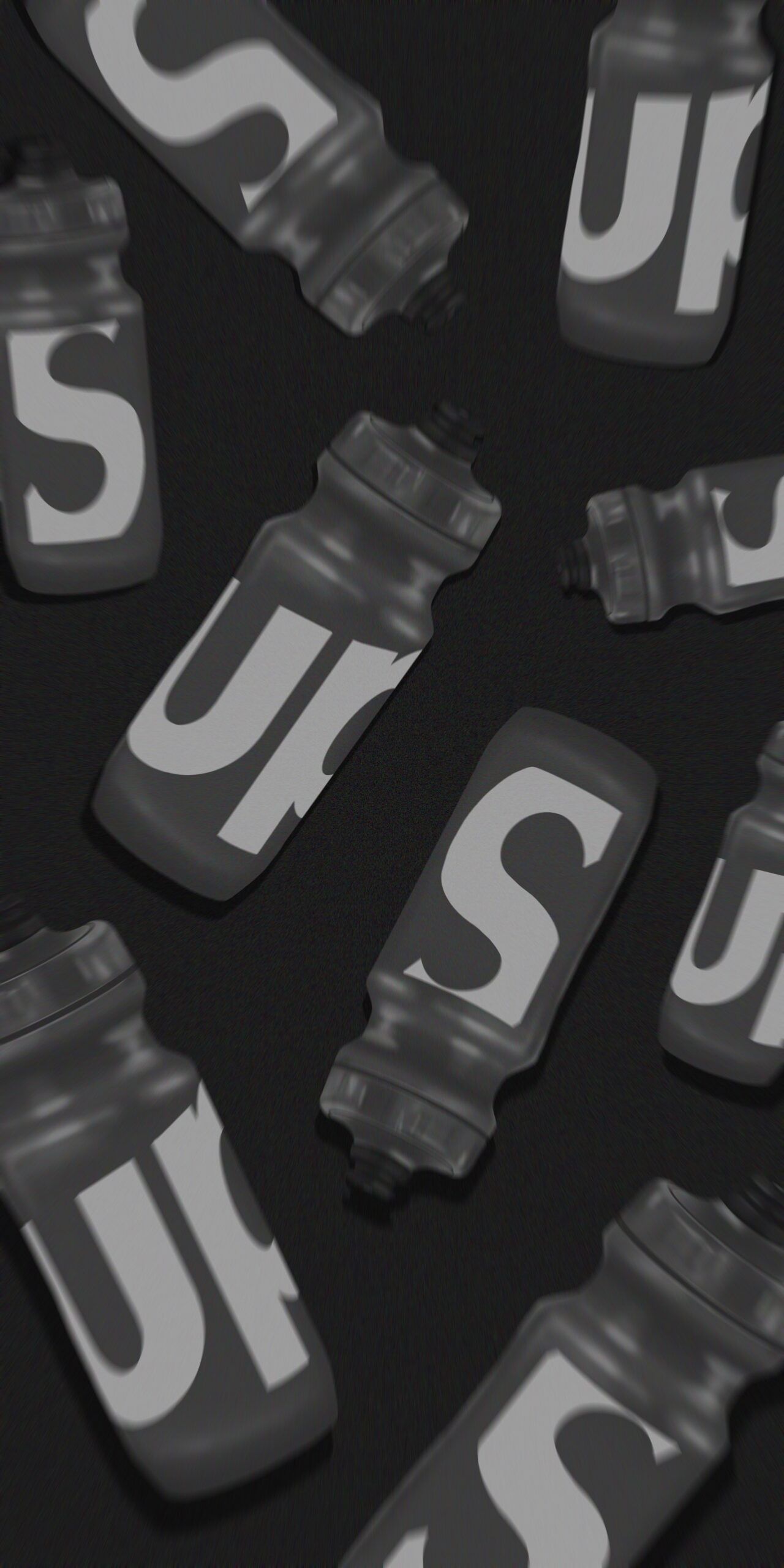 A black and white picture of a number of different sized water bottles with the word 