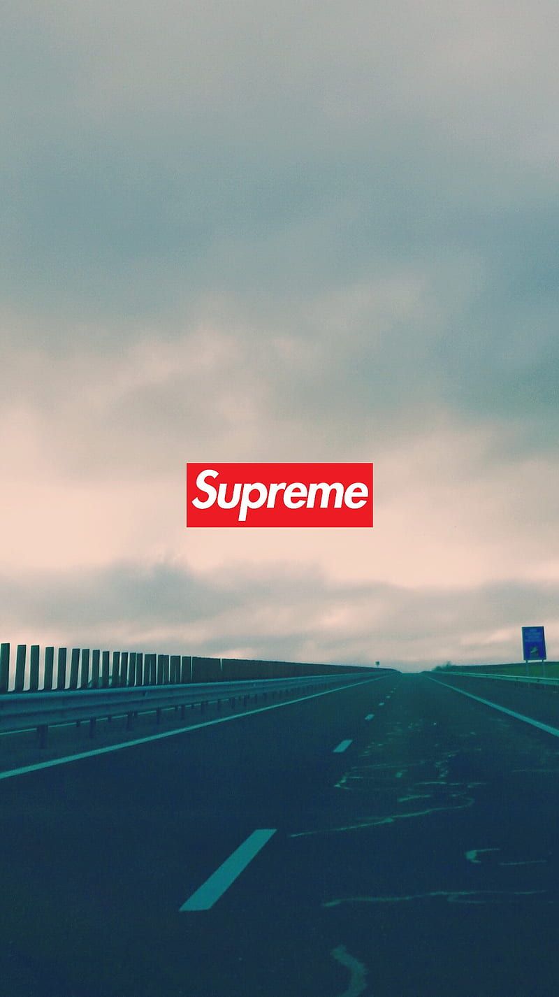 A photo of a highway with the Supreme logo on top - Supreme