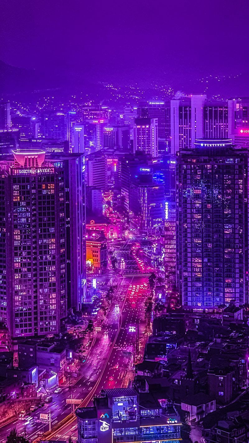 A purple tinted city at night with a purple lit road - City, skyline