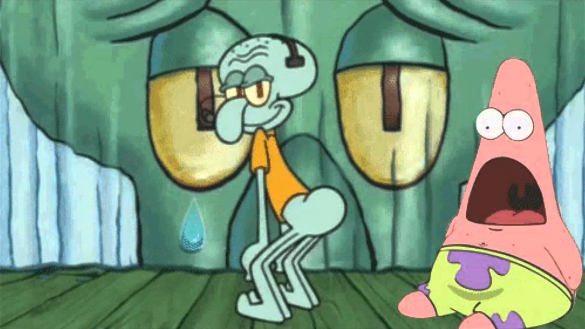 Squidward is sitting on the floor with a tear coming out of his eye, while Patrick is looking at him with a confused expression on his face. - Squidward