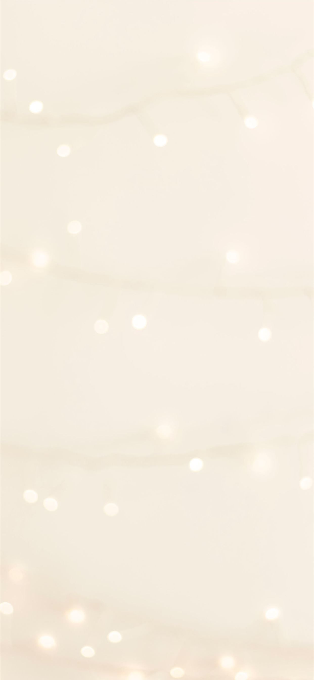 IPhone wallpaper with white bokeh lights on a cream background - Beige