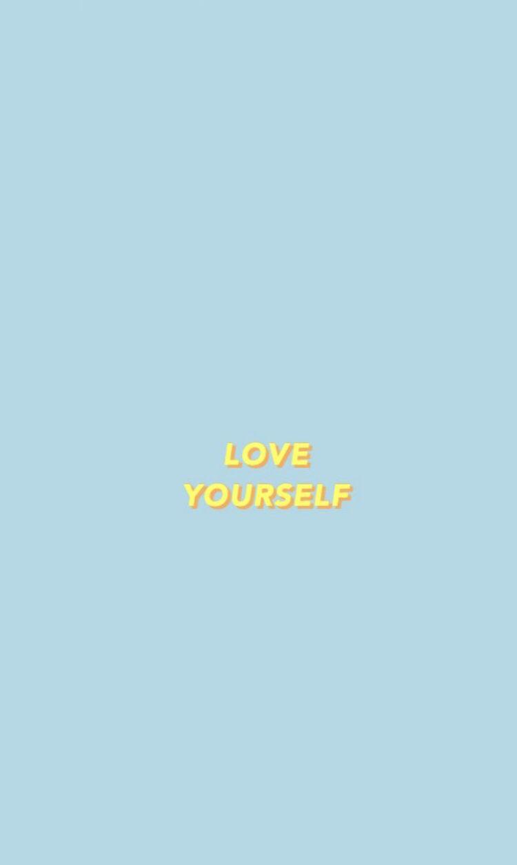 A blue background with the words love yourself in yellow - Love