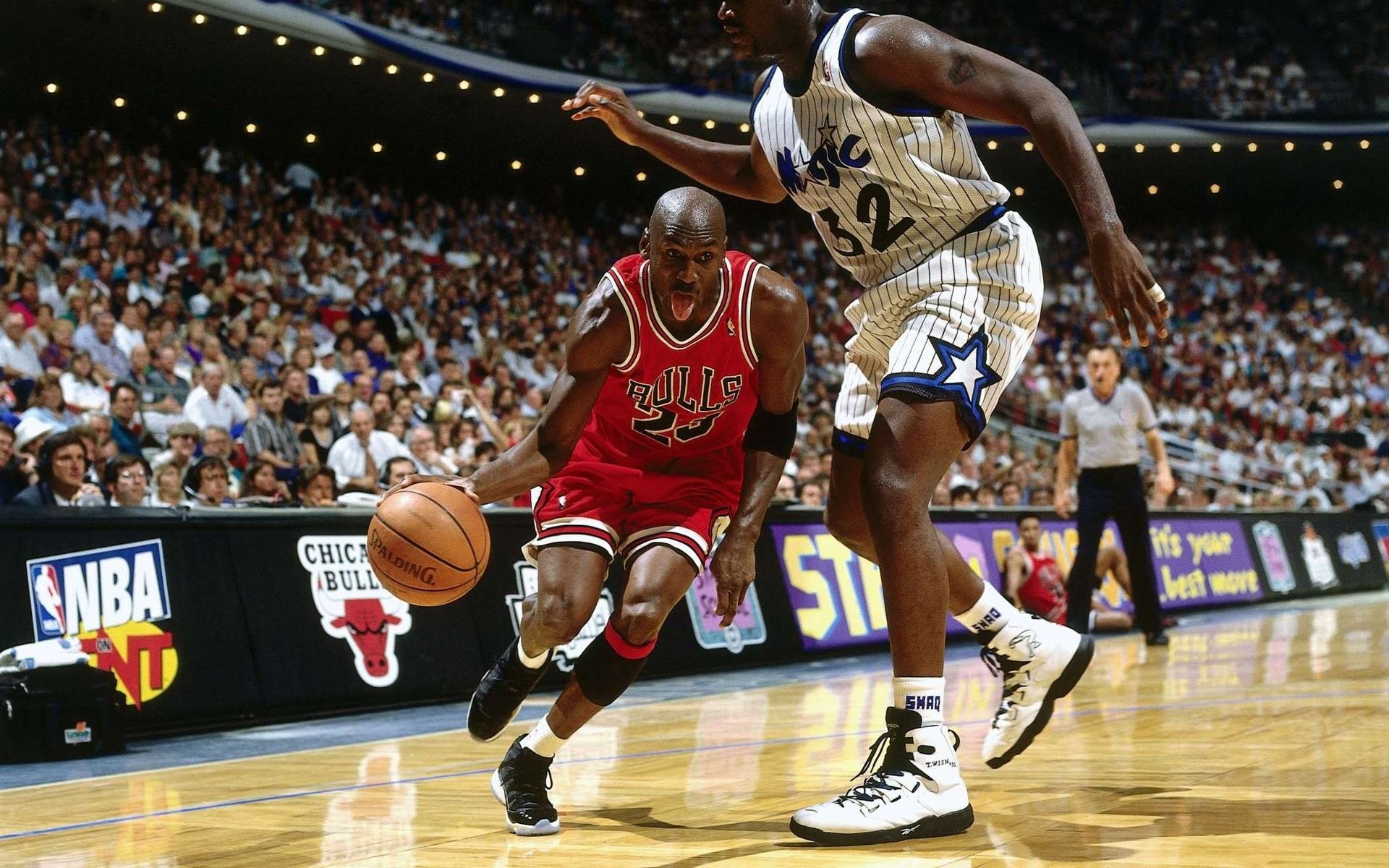 The Bulls' Michael Jordan dribbles the ball past the Magic's Shaquille O'Neal during the 1995 NBA Finals. - Michael Jordan