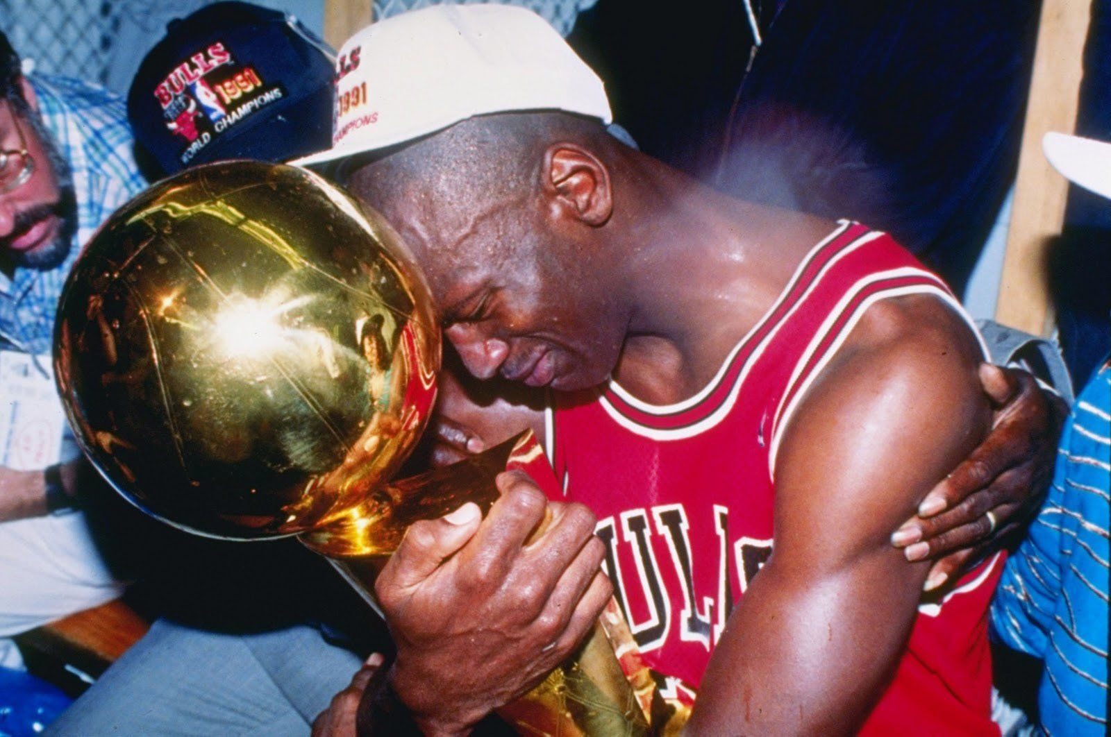 Michael Jordan holding the NBA championship trophy and crying - Michael Jordan, Air Jordan