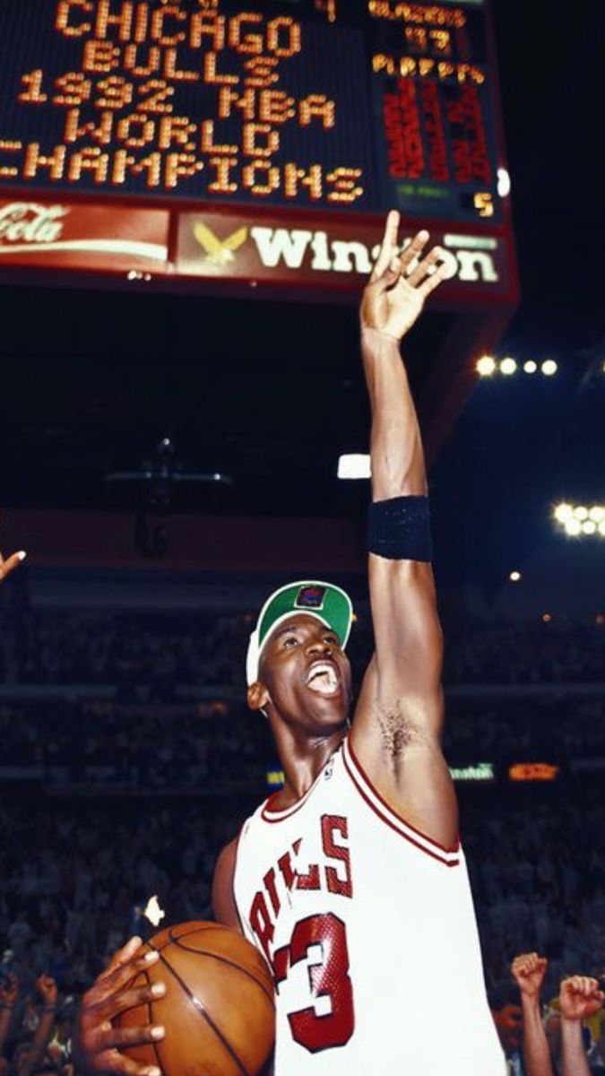 Michael Jordan of the Chicago Bulls celebrates after winning his fifth NBA championship in 1991. - Michael Jordan