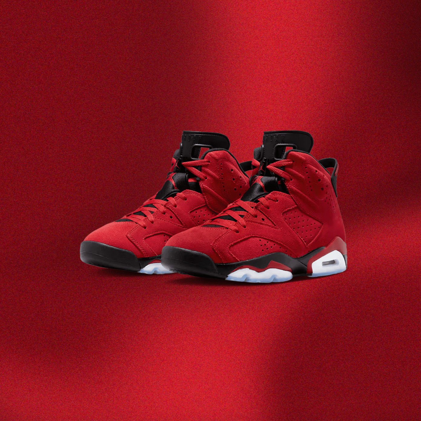 A pair of red Nike sneakers on a red background - Air Jordan 6