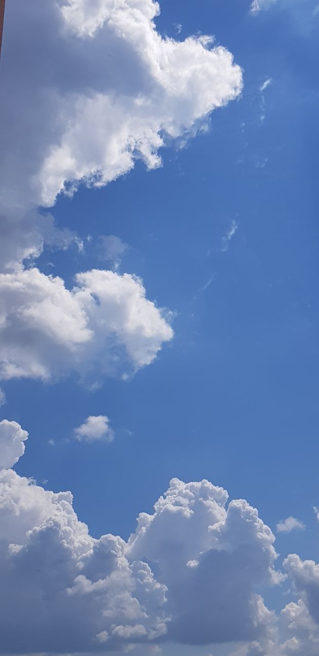 A blue sky with white clouds - 