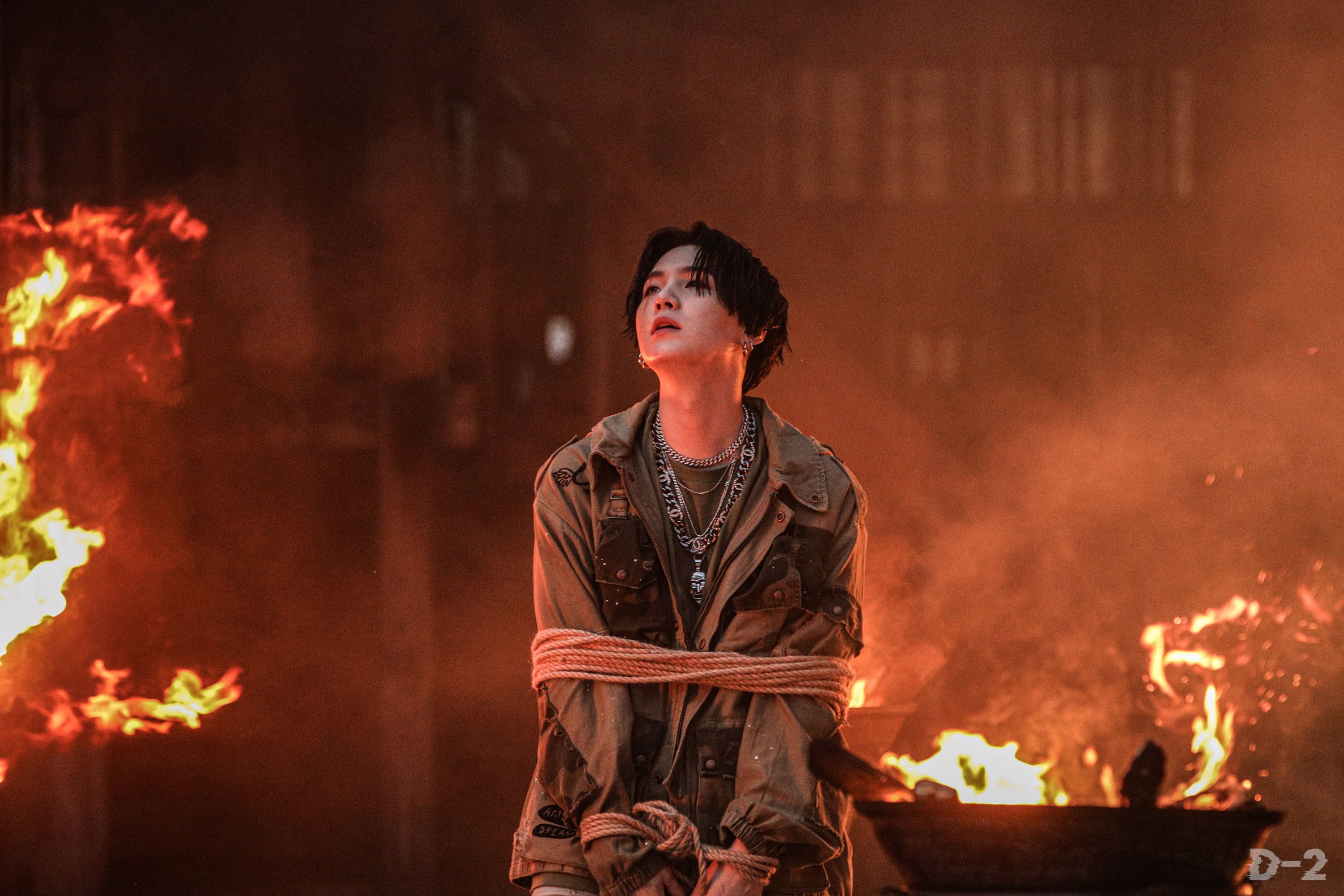 The last image of the series, which shows a man tied up in front of a fire, is the most intense. - Suga
