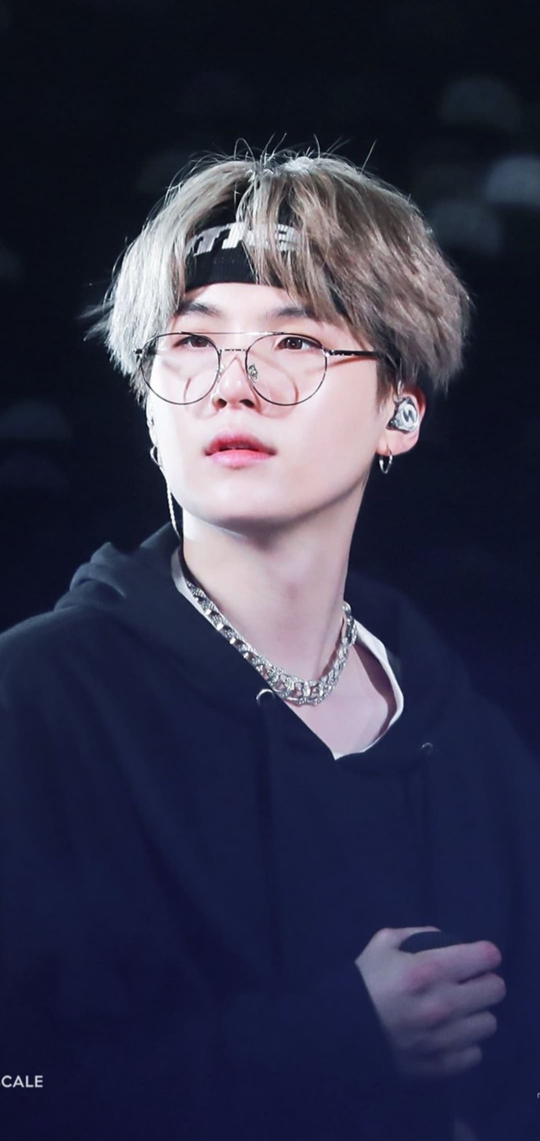 Jin of BTS with glasses and a black hoodie - Suga