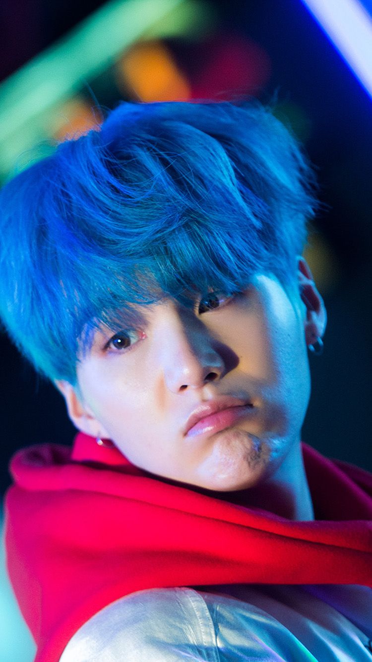 BTS Jimin in neon lights, blue hair, red hoodie, looking at the camera - Suga