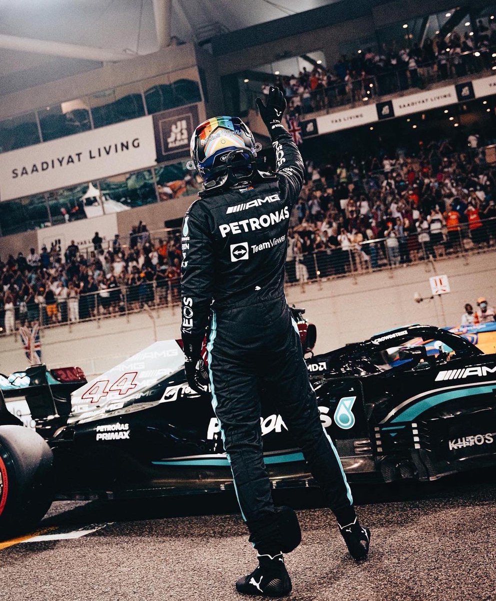 The driver of the black Mercedes-AMG Petronas F1 W11 waves to the crowd - Lewis Hamilton