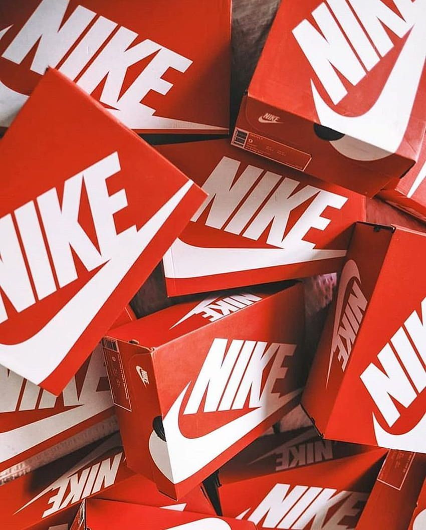 A pile of red Nike shoe boxes - Nike