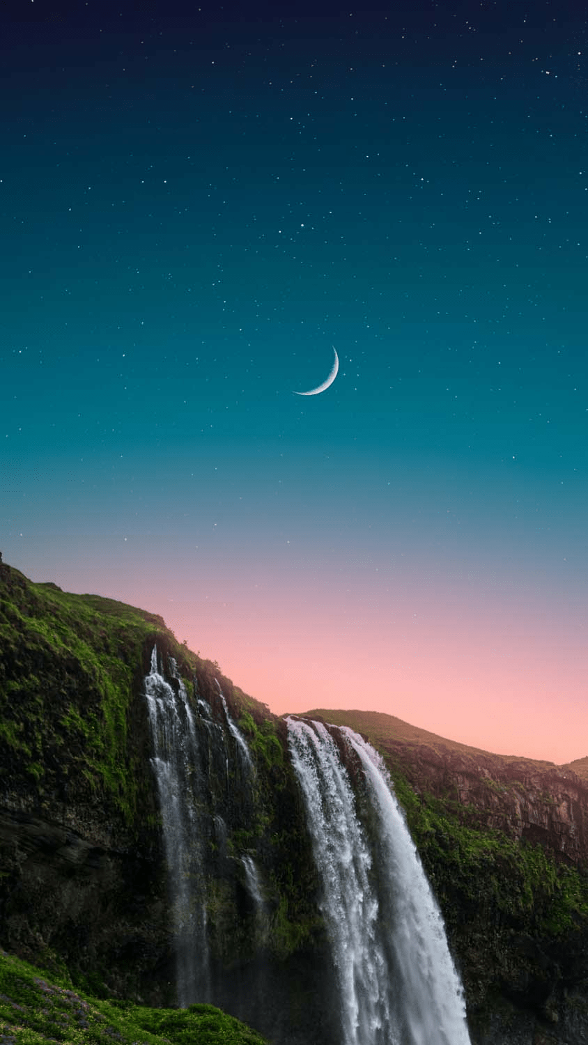 A stunning image of a waterfall with a crescent moon in the sky. - Waterfall