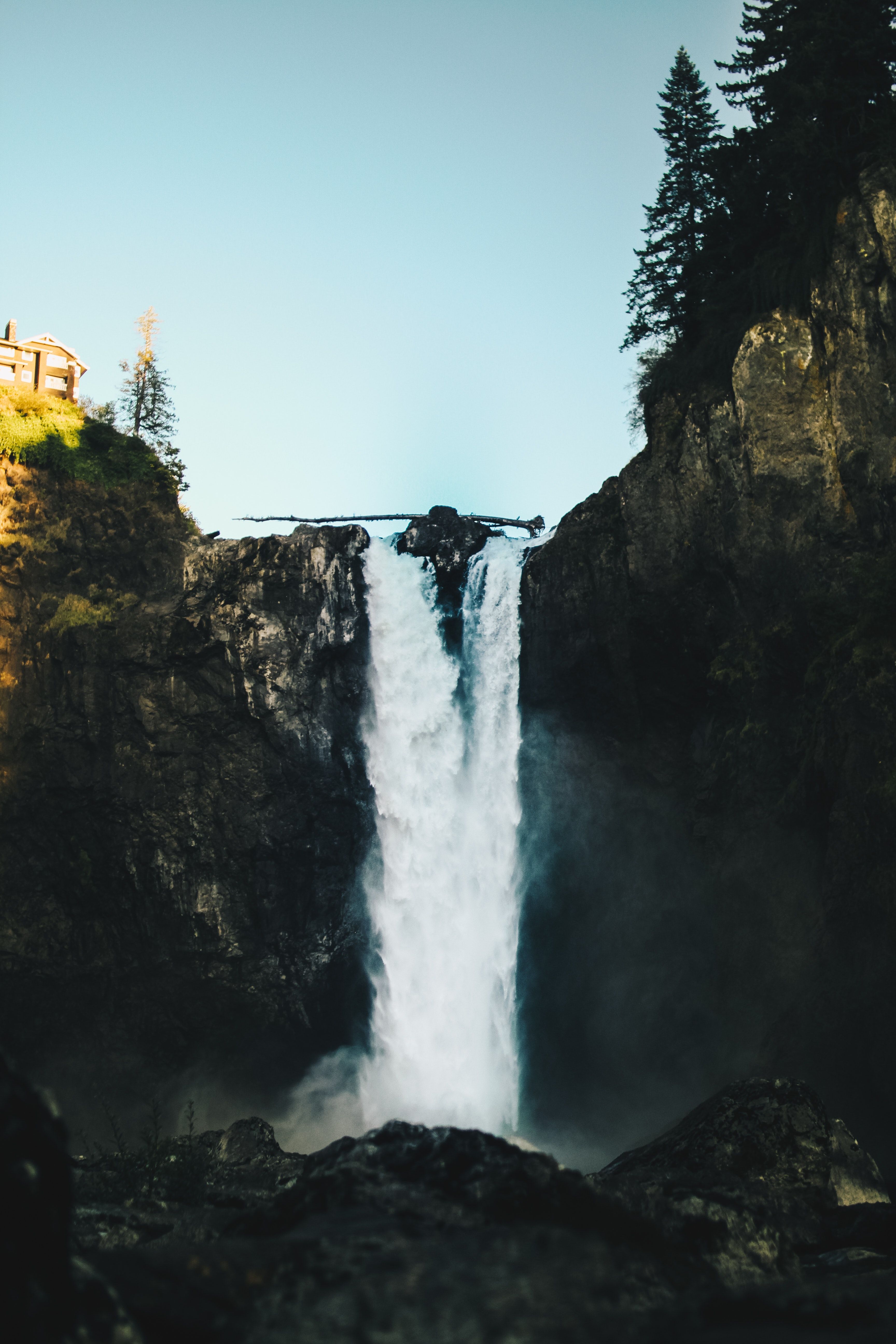 A waterfall that is flowing down the side of mountain - Waterfall