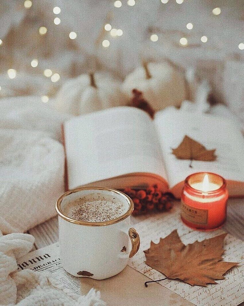 A cup of coffee and some books on the bed - Cozy