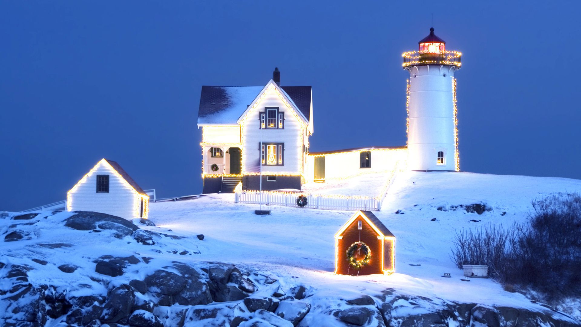 A lighthouse with Christmas lights on it - Cozy, winter