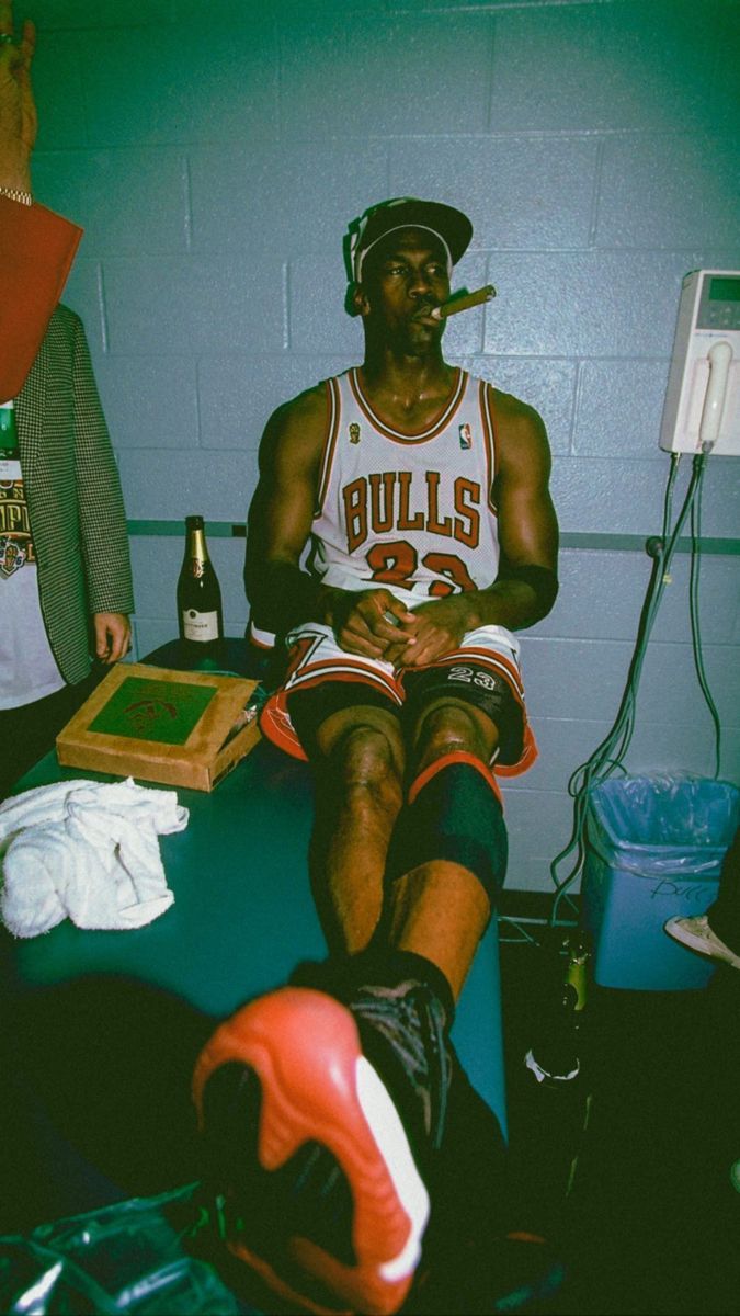 Michael Jordan with a cigar in his mouth. - Michael Jordan