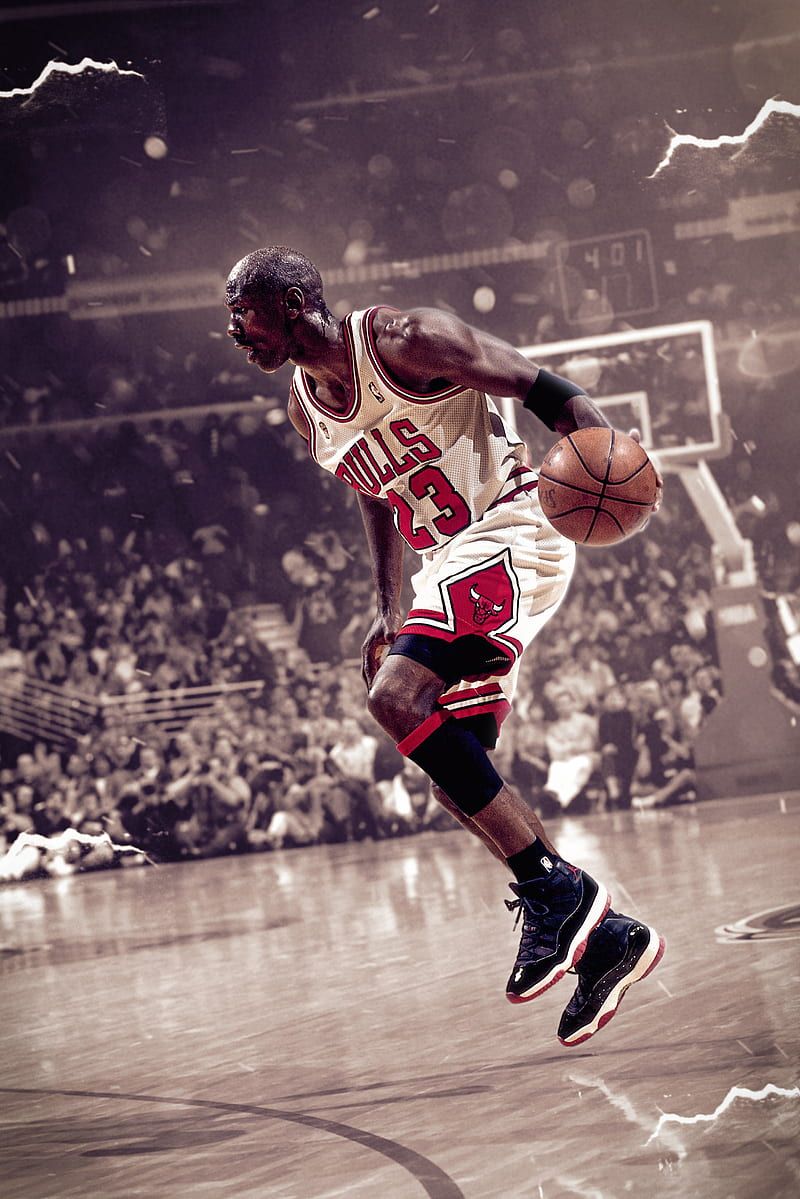 Michael Jordan playing basketball in front of a crowd. - Michael Jordan