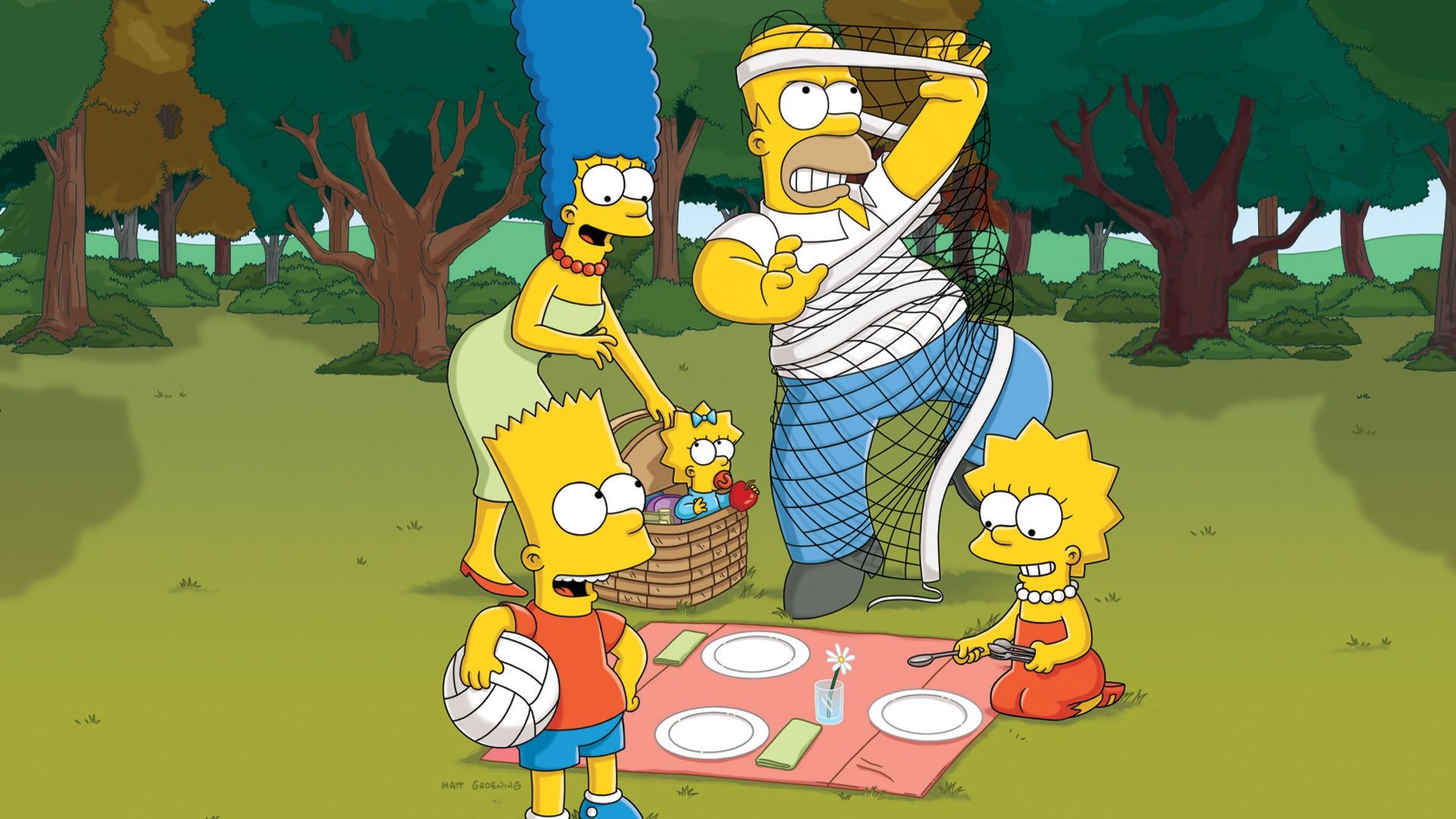 The Simpsons family in a park, with Homer, Marge, Bart, Lisa and Maggie sitting on a picnic blanket - The Simpsons
