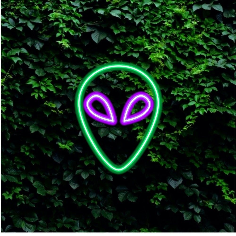 A green and purple neon alien sign. - Alien