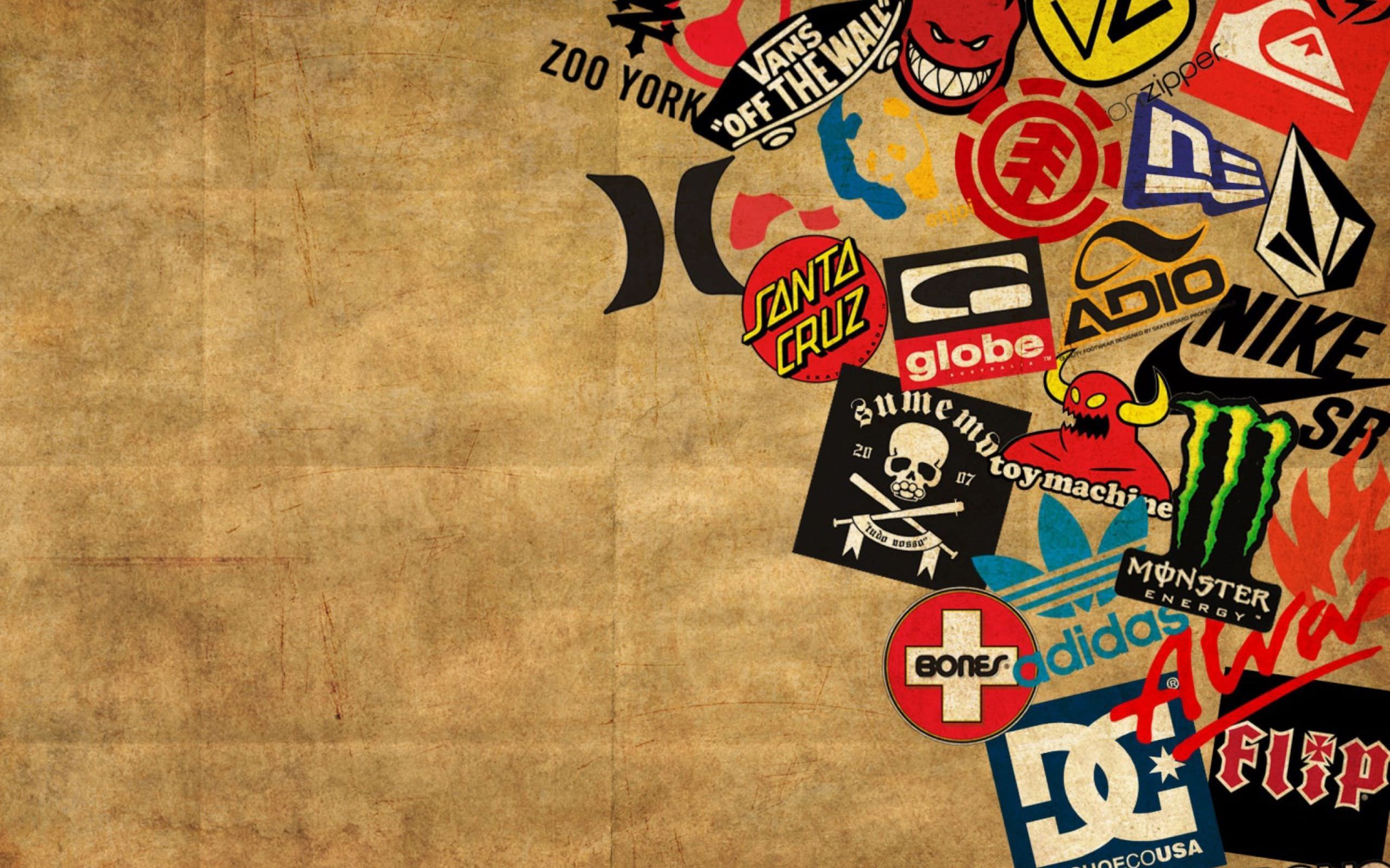 A wallpaper of many different brand stickers on a brown background - Vans