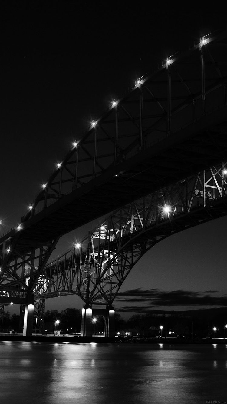 The bridge is lit up at night - River