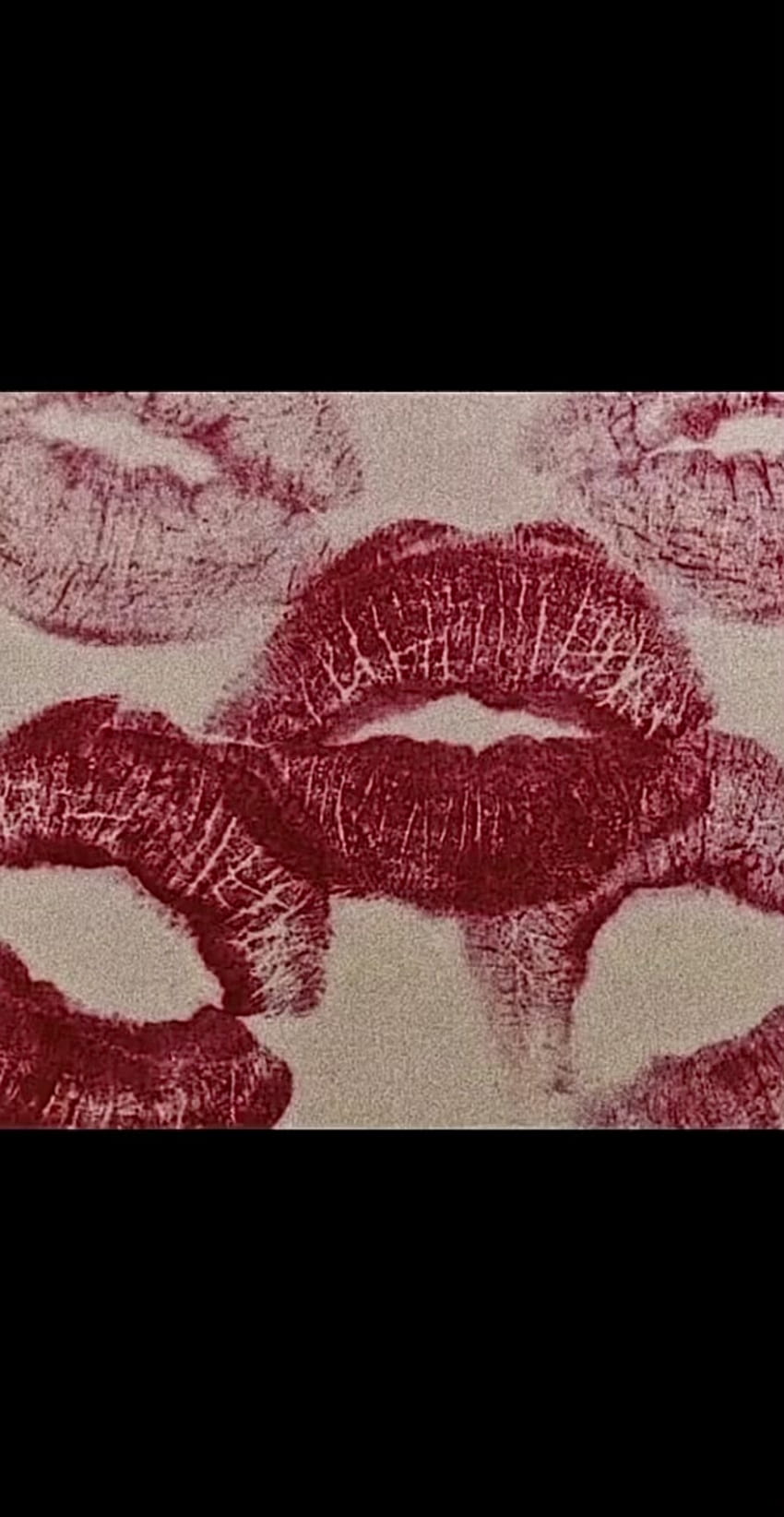 A close up of a piece of fabric with a design of red lips on it. - Lips