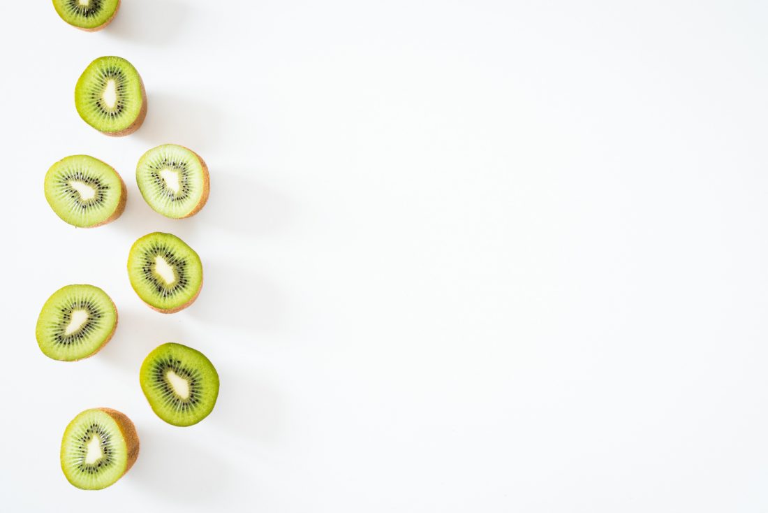 Sliced kiwi fruit on a white background - Kiwi