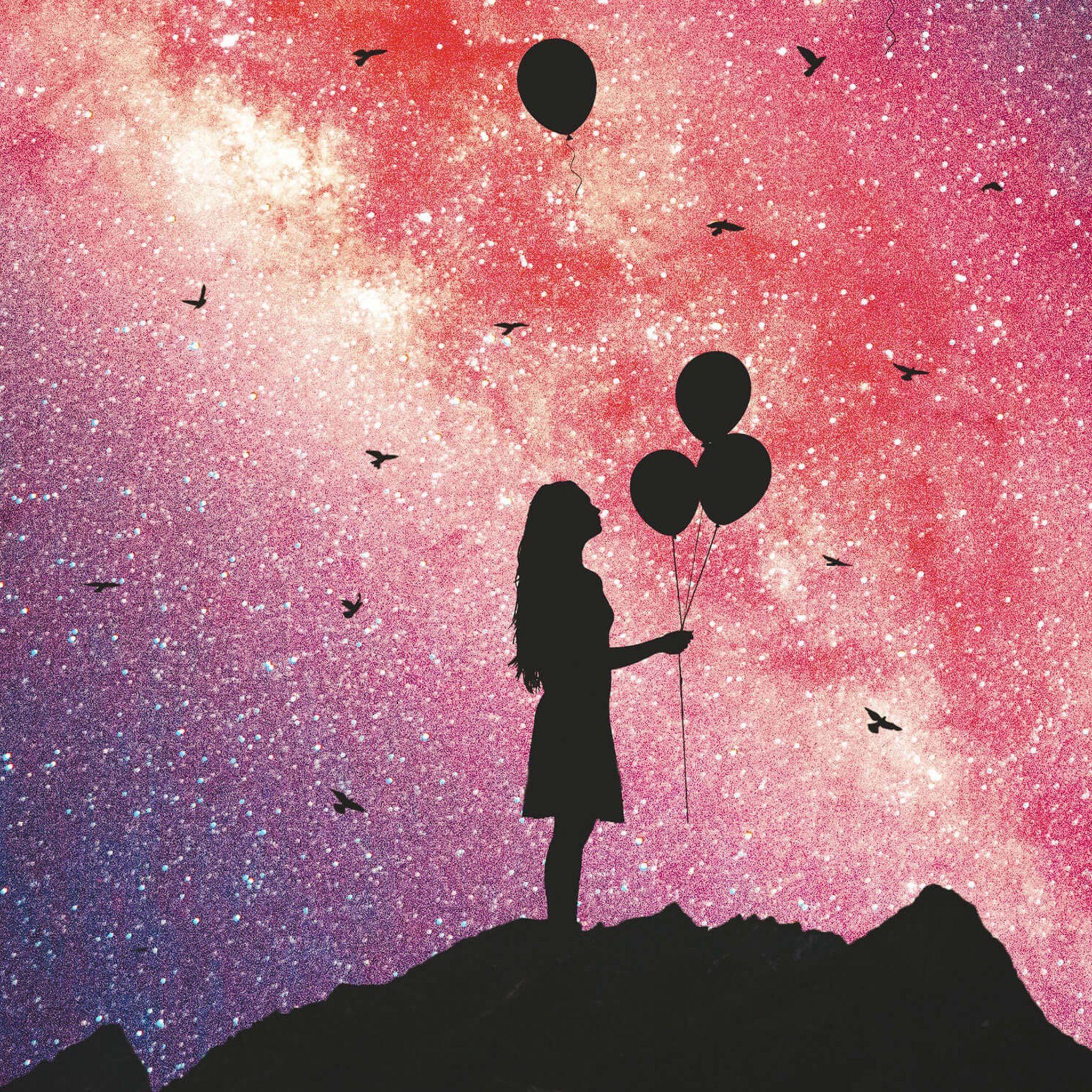Girl holding balloons in front of a starry sky. - Balloons