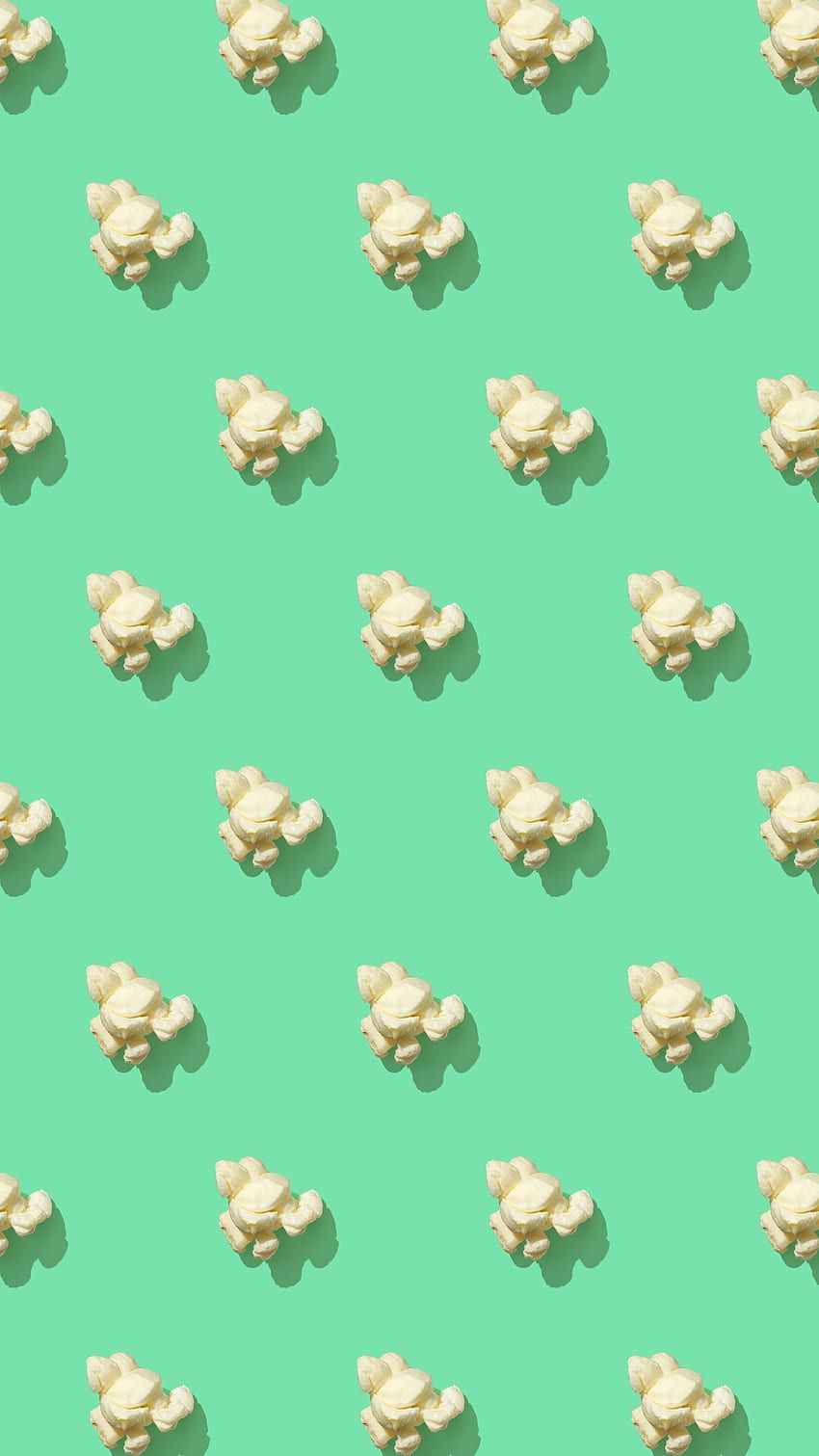 A green background with rows of popcorn - Popcorn
