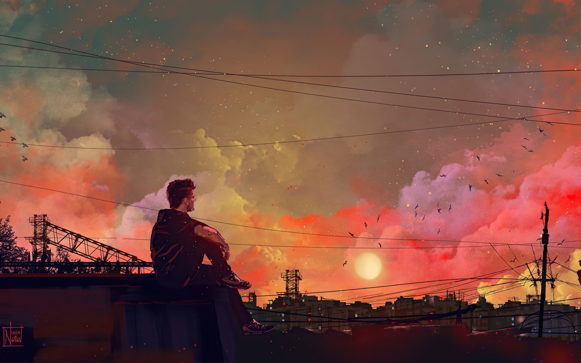 A man sitting on a roof looking at the sunset - 1920x1200
